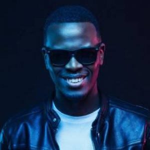 studio-portrait-of-smiling-african-american-male-model-wearing-trendy-sunglasses-and-leather-jacket-e1655156746850